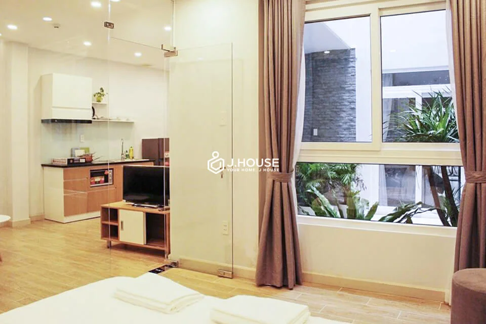 Seperate glass-walled bedroom with green garden in District 3
